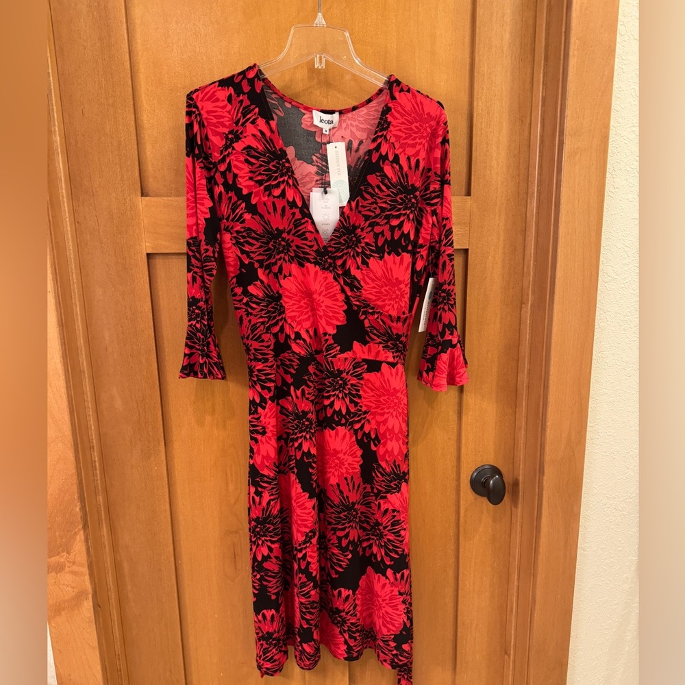 Cute faux wrap dress with flare sleeves and belted waist
